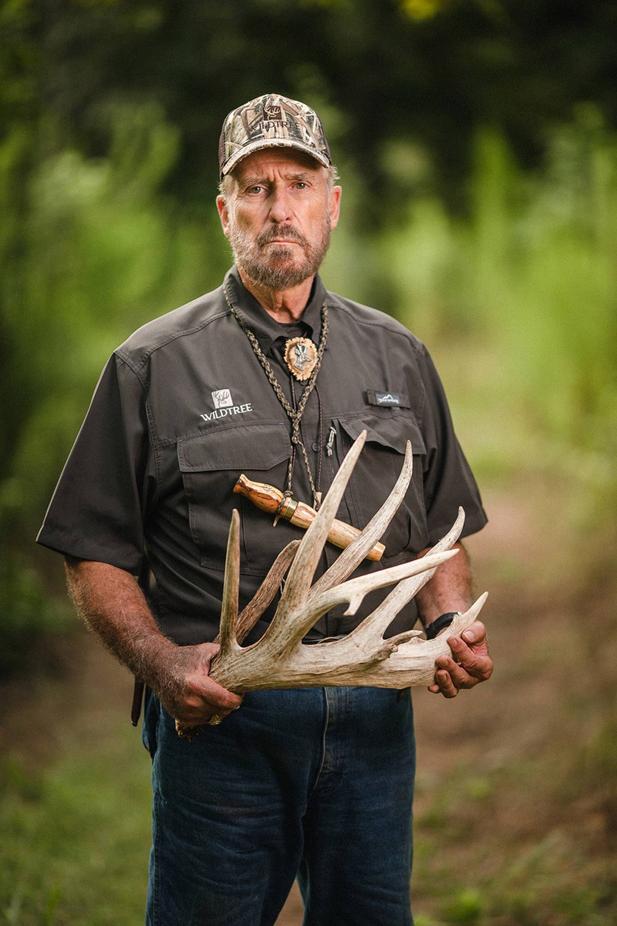 Dr. Deer holding an antler